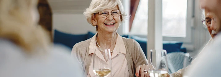 Chiropractic Laguna Beach CA Nutrition Elderly Woman at Dinner with Wine Glass