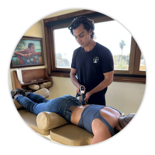 Chiropractic Laguna Beach CA Shockwave Therapy On Patients Back